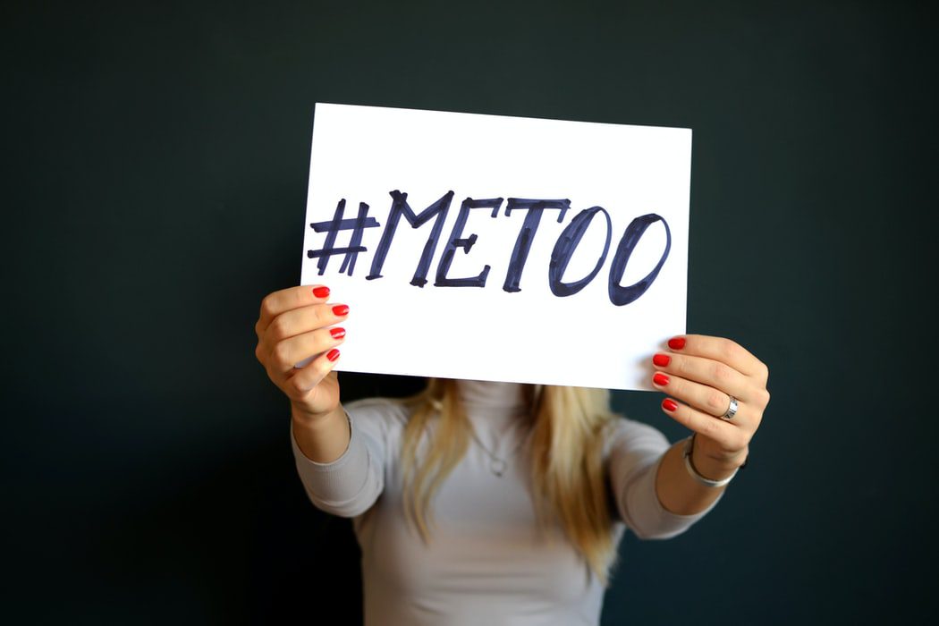 A women holding up a piece of paper stating "me too," contact our San Mateo law firm if you believe you are getting sexually harassed at work.
