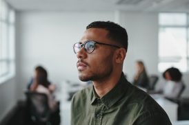 A man thinking. If you believe you are being discriminated against at work, contact our Oakland discrimination attorney at The Law Office of Jeannette Vaccaro.