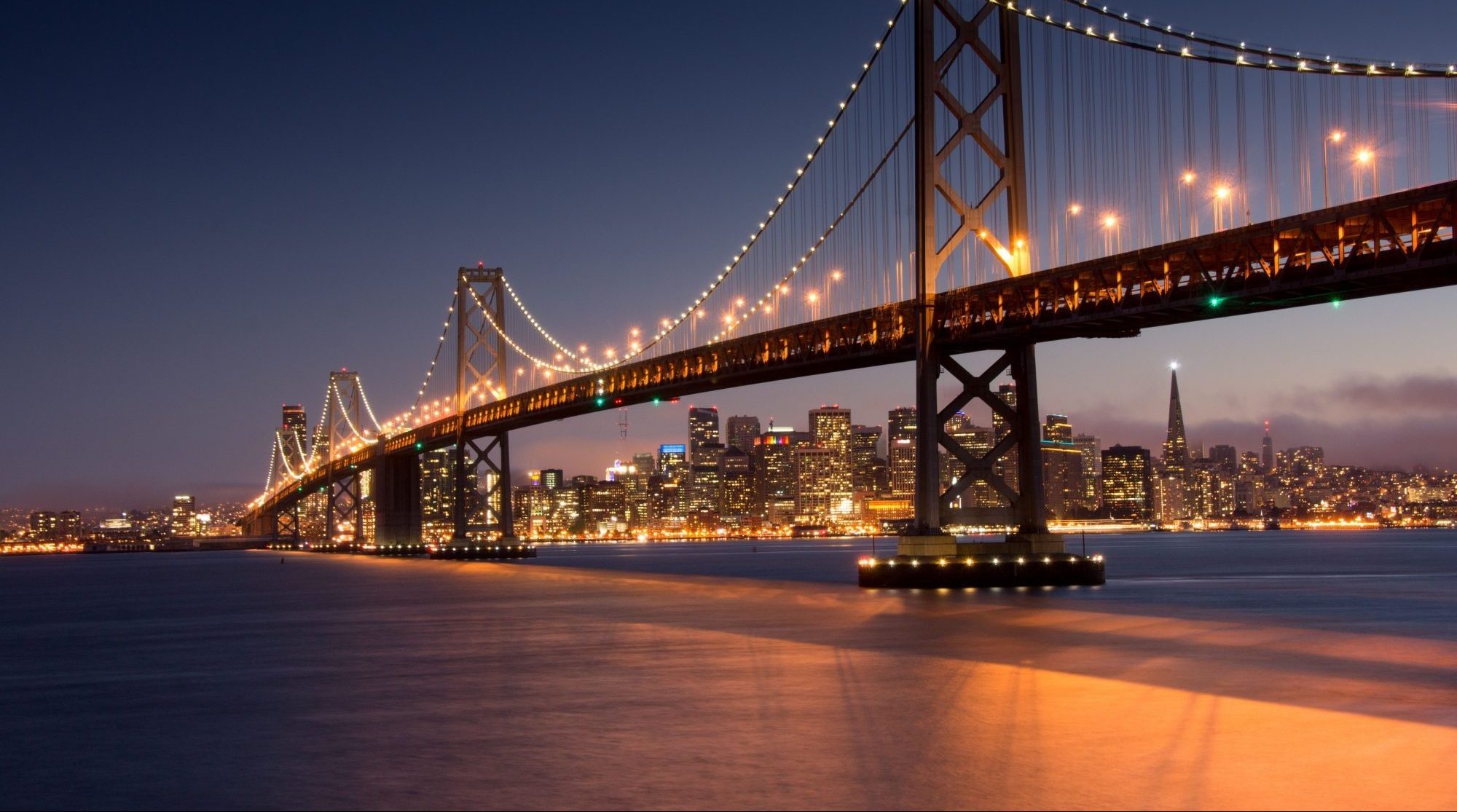 An image of the Golden Gate Bridge at night. If you have been discriminated against, contact the Oakland discrimination attorneys at The Law Office of Jeannette Vaccaro.