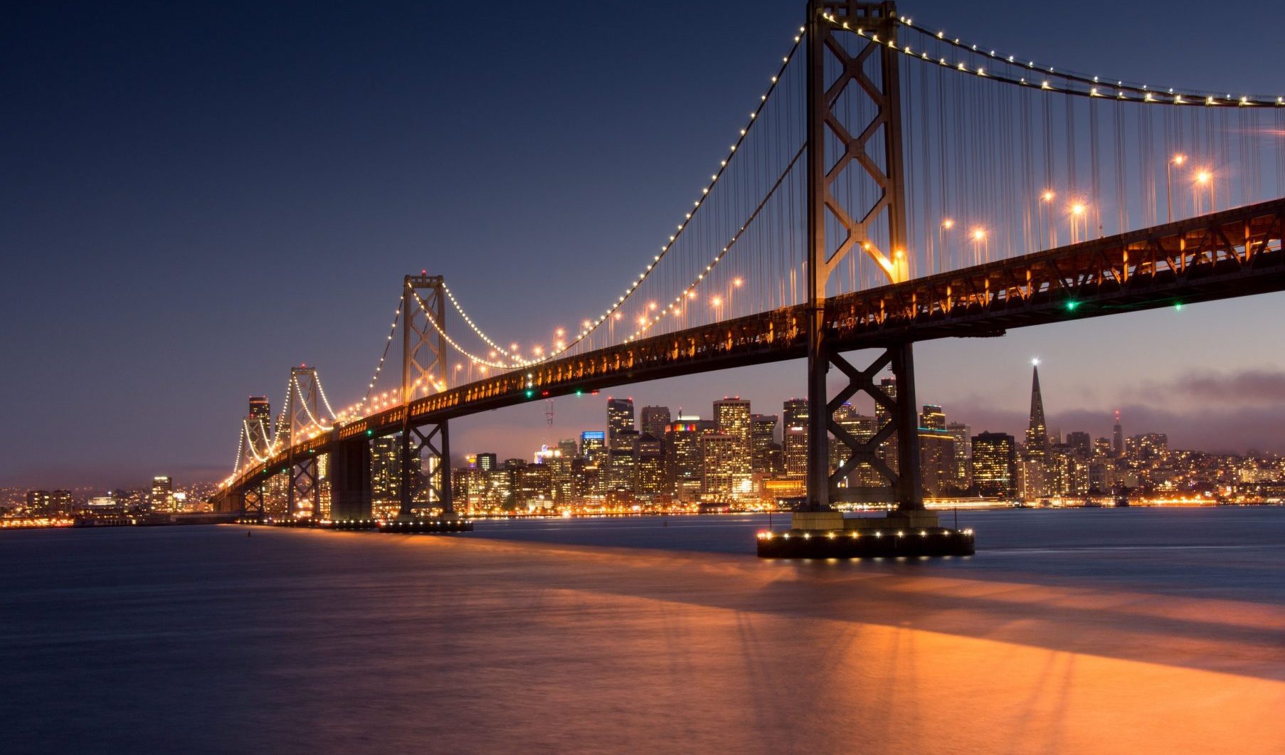 An image of the Golden Gate Bridge at night. If you have been discriminated against, contact the Oakland discrimination lawyers at The Law Office of Jeannette Vaccaro.