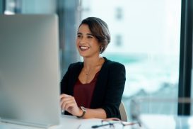Woman working at desk at work, turn to Workplace Retaliation Attorney San Francisco to learn about your employee rights.